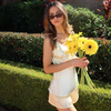 Women walking outside with daisy flowers in the LuLu set Butter Yellow